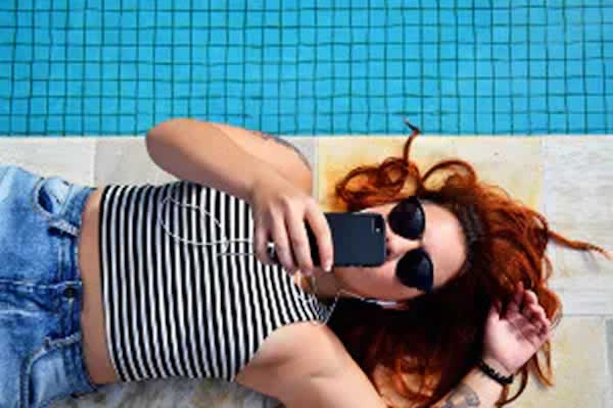 Lady with Phone By Pool