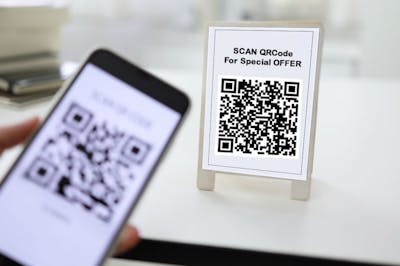 Shoppers Scan QR Code For A Discount