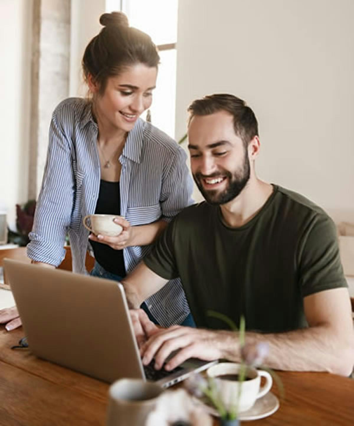 Couple Looking At Laptop