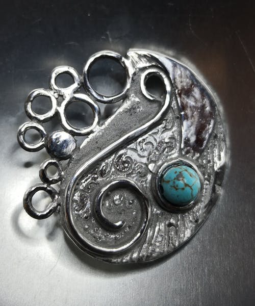 ciondolo in acciaio con turchese