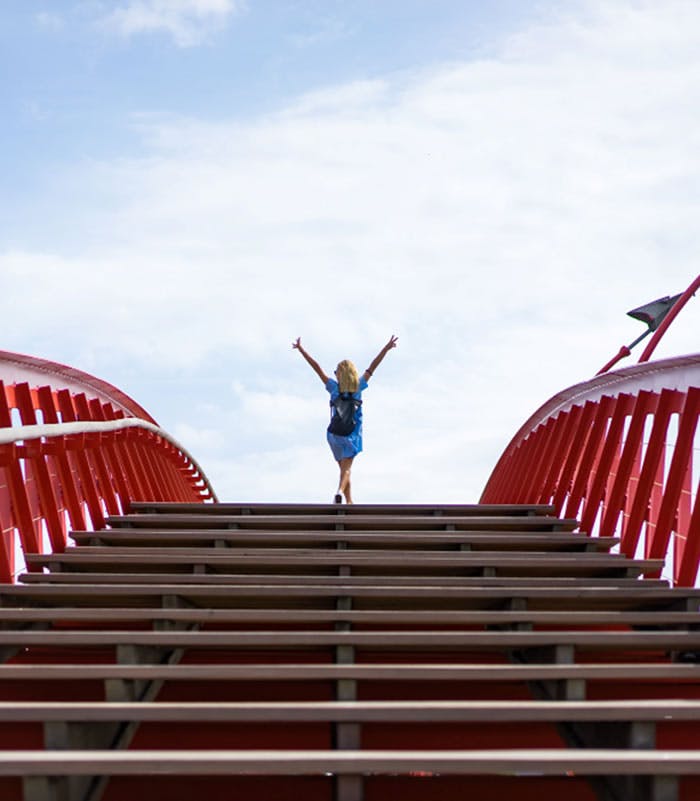 Woman with hands up from being successfull