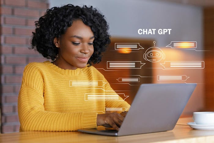 Woman on laptop looking at GPT