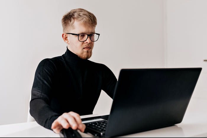 Guy looking at computer