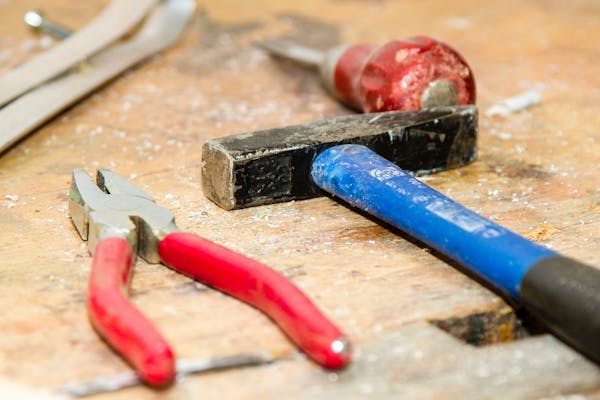 Construction tools on a wooden table.