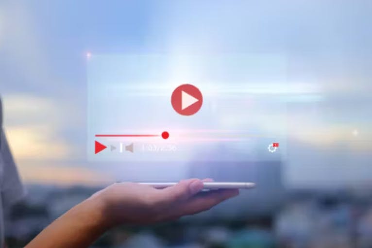 video in palm of hand press play