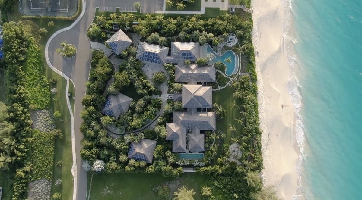 Luxury beachfront homes for sale on Paradise Island Bahamas with pristine white sand beaches and turquoise waters