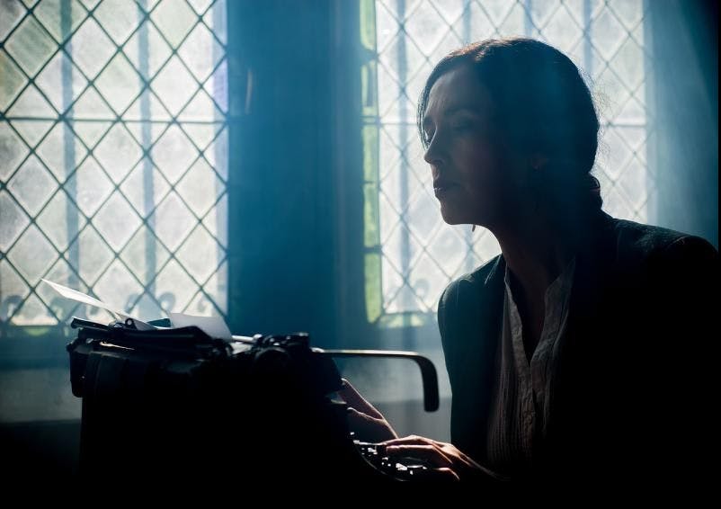 Author writing a book